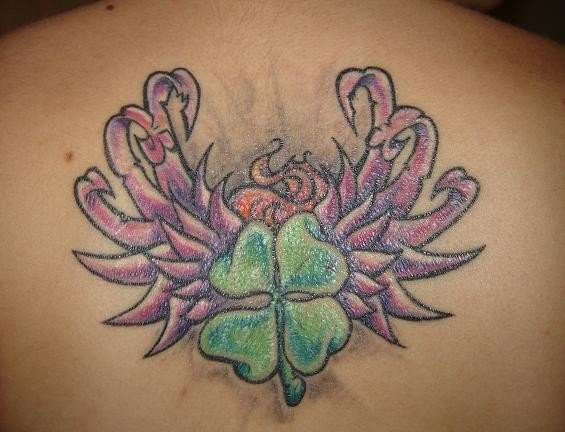 shamrock and wings tattoo