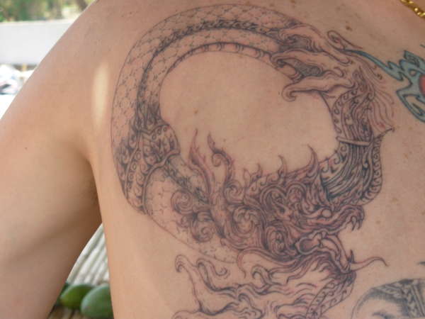 Thai dragon detail tattoo