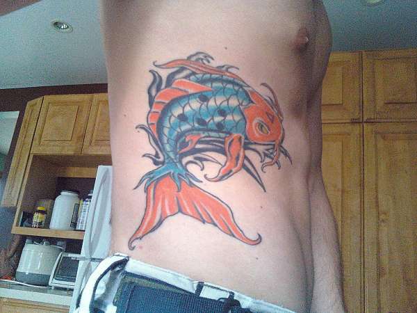 koi on side close up tattoo