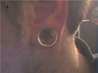 Stars behind ears tattoo