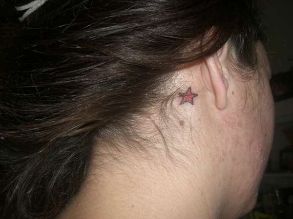 star behind ear tattoo