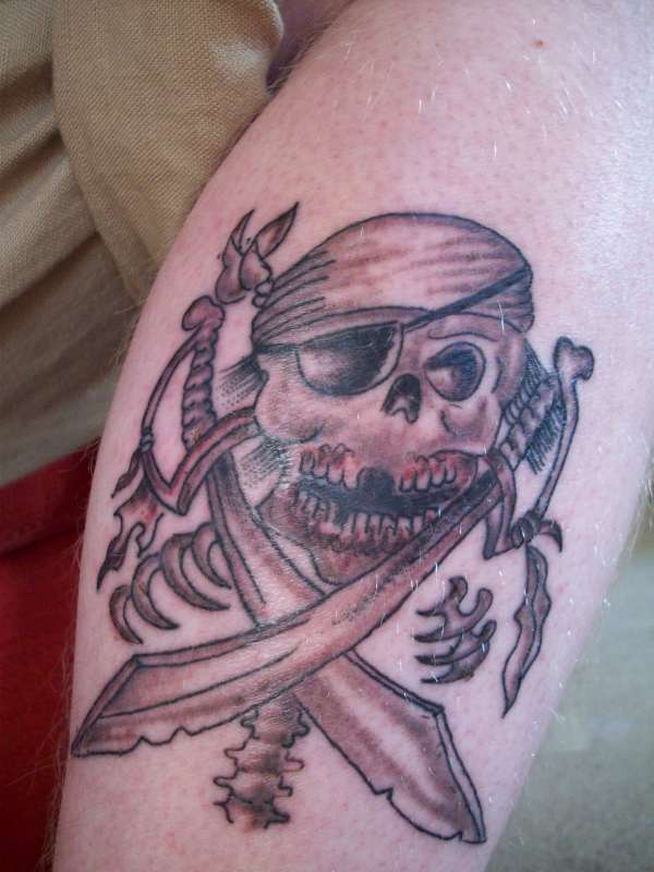 skull and cross swords tattoo