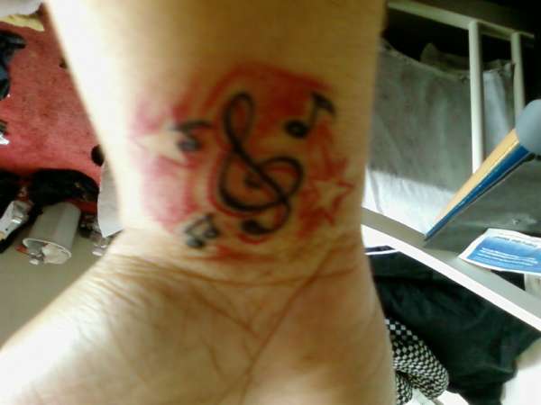 red musical galaxy tattoo