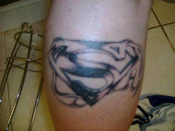 Super man leg tat tattoo