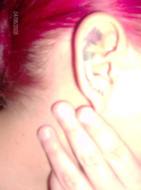 rose on my ear tattoo