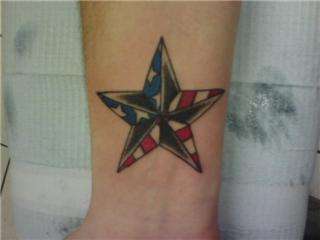 American flag/Nautical star, right wrist tattoo