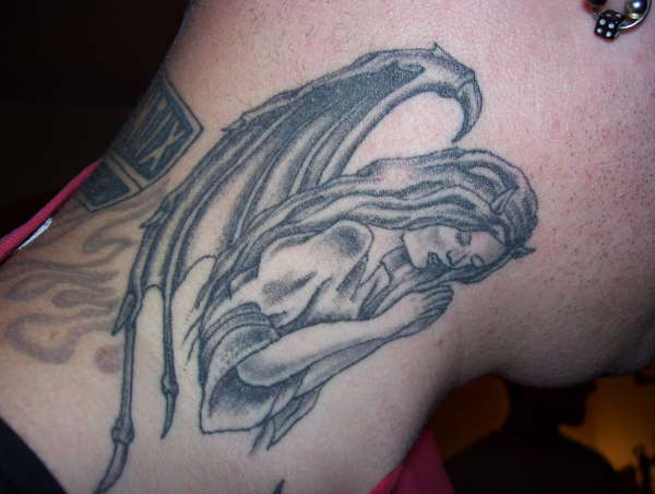 evil angel tattoo