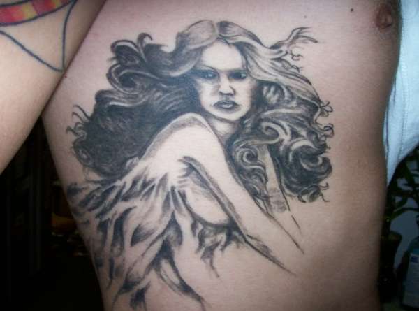 fairi lady on ribs tattoo