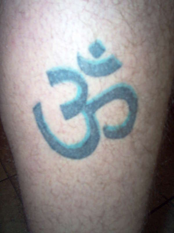 ohm on leg tattoo