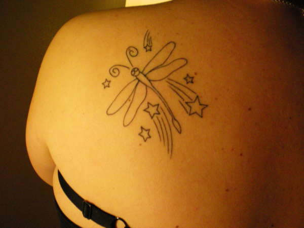 Dragonfly with stars tattoo