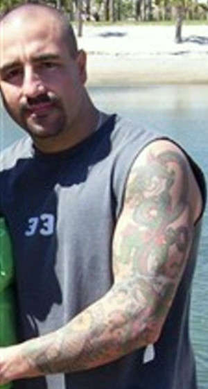 Left full sleeve of a koi and a dragon tattoo