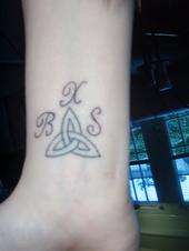 Sons initials tattoo