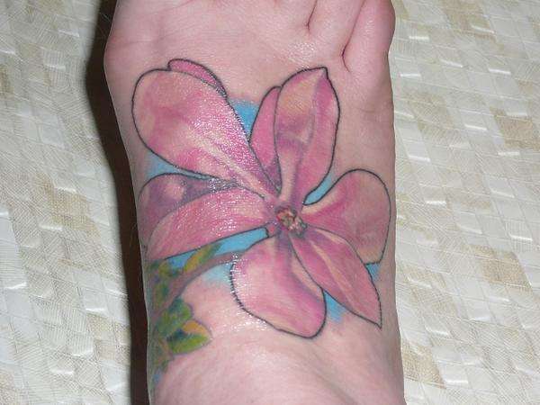 magnolia on foot tattoo
