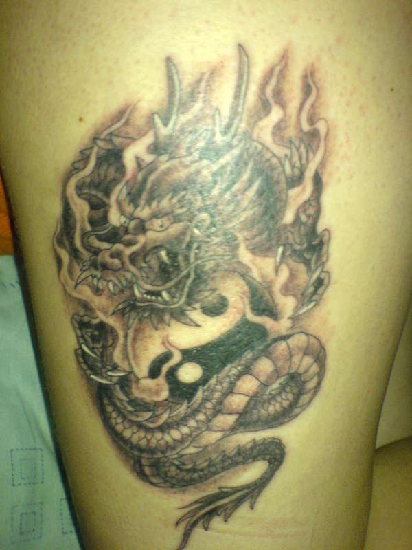 Dragon with ying yang tattoo