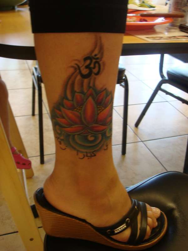 Lotus Flower with Ohm Symbol tattoo