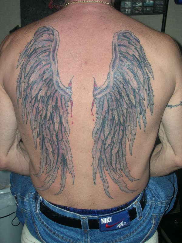 wings (balack light) tattoo