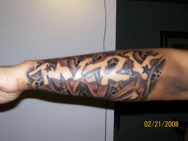 name in graffiti style tattoo