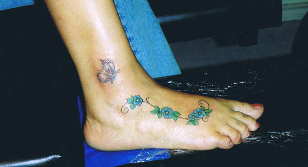 flowers on foot tattoo