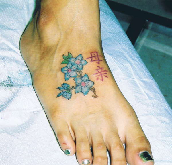 foot flowers tattoo