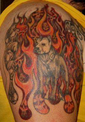Pit surronded by skulls & flames tattoo