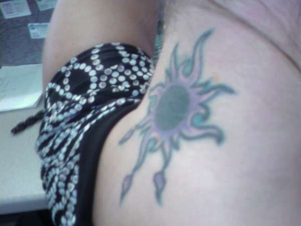 Cover Up Sunburst on back of neck tattoo