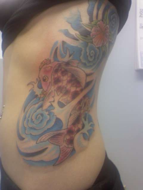Koi, flower, and waves tattoo