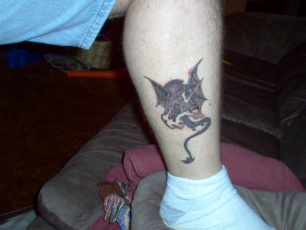 Leg winged dragon tattoo