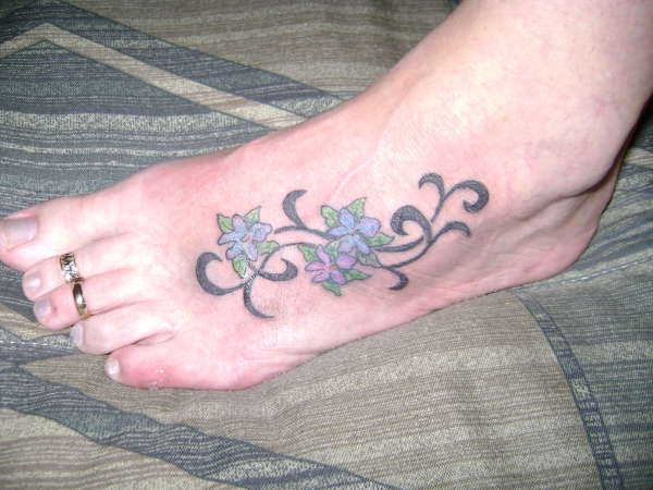 popual foot piece tattoo