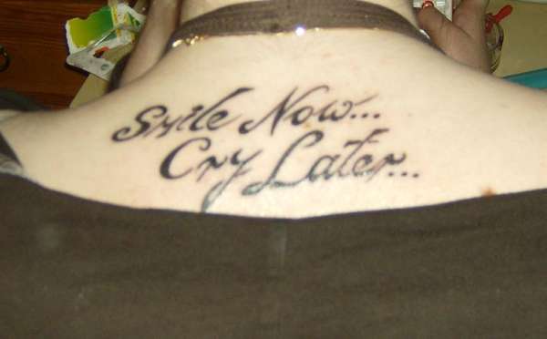 traditional smile now cry later tattoo