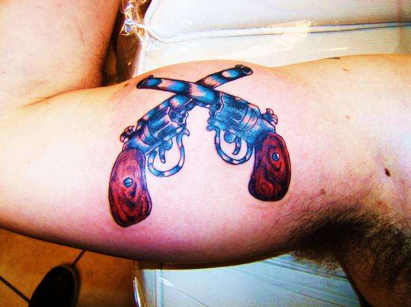 Gun crap tattoo