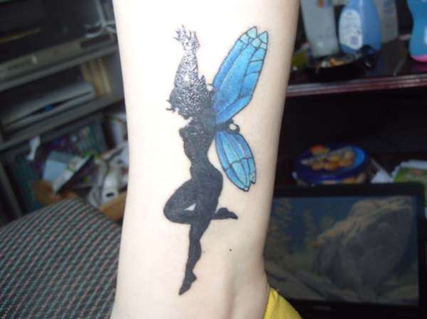 Dancing fairy on left ankle tattoo
