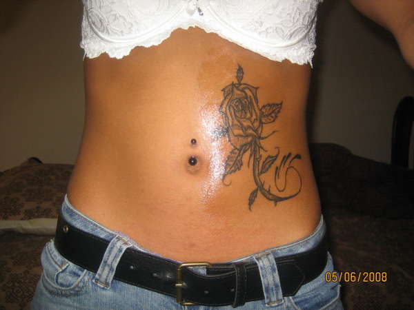 my first tattoo and i love it (my rose) tattoo