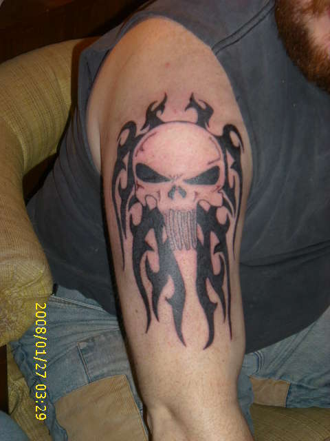 punisher skull with tribal tattoo