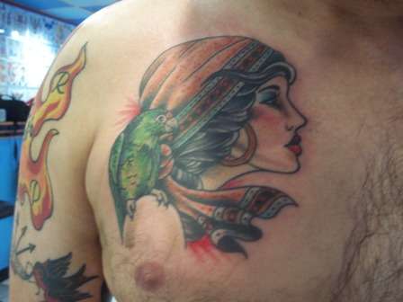 Gypsy with Puerto Rican parrot tattoo