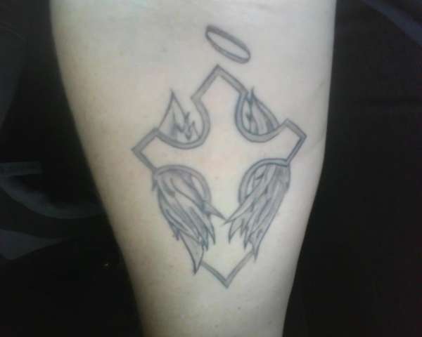 Angel Cross tattoo