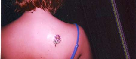 pink daisy tattoo