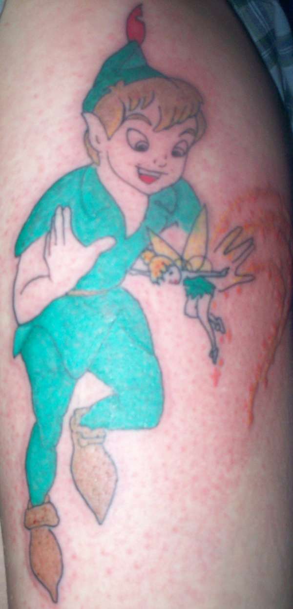 Peter pan on top of leg tattoo
