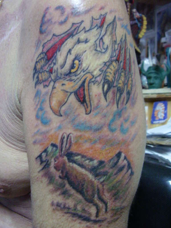 eagle hunting rabbit tattoo