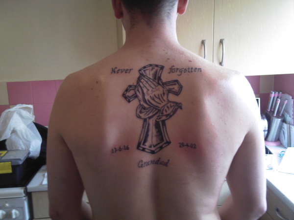 in  memery cross tattoo