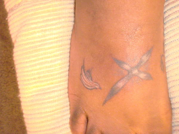 cross and dove tattoo