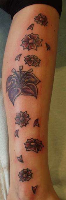 Flowers on leg tattoo