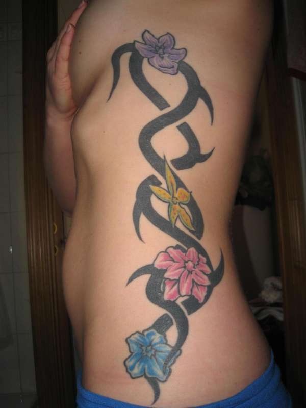Tribal with flowers tattoo