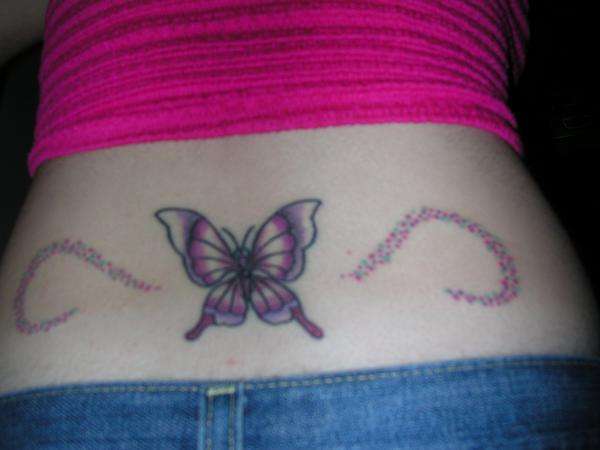 butterfly with rainbow confetti tattoo