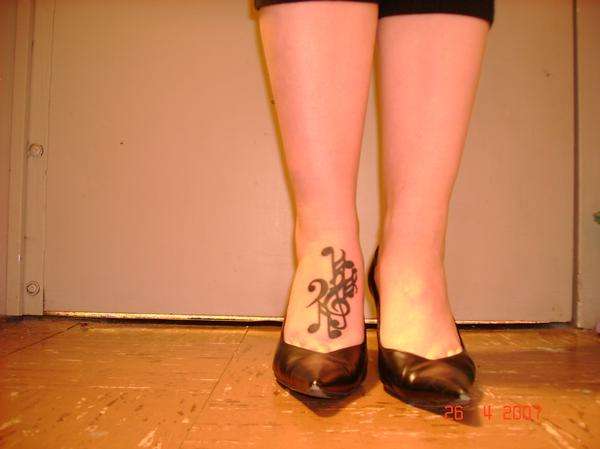 music collage tattoo