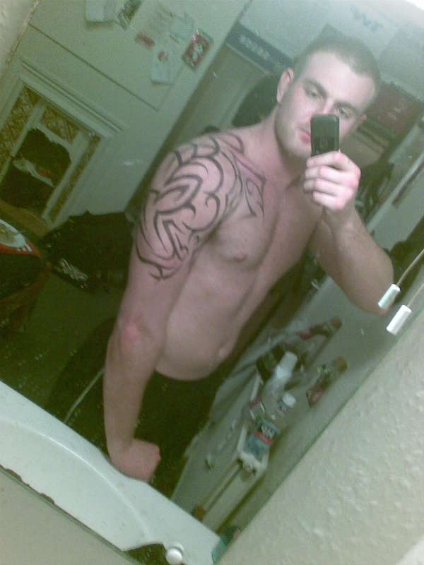 Tribal arm shoulder chest tattoo