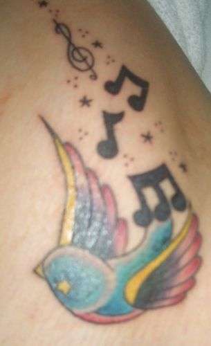 bird and music notes tattoo