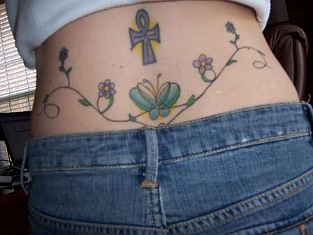 low back daisies and butterfly tattoo