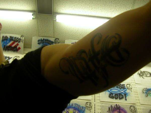 under arm tattoo