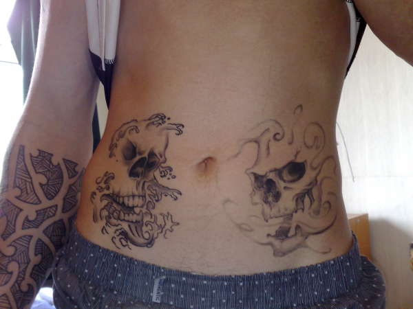 Belly Skulls tattoo