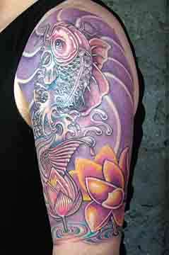 Koi with lotus flowers tattoo